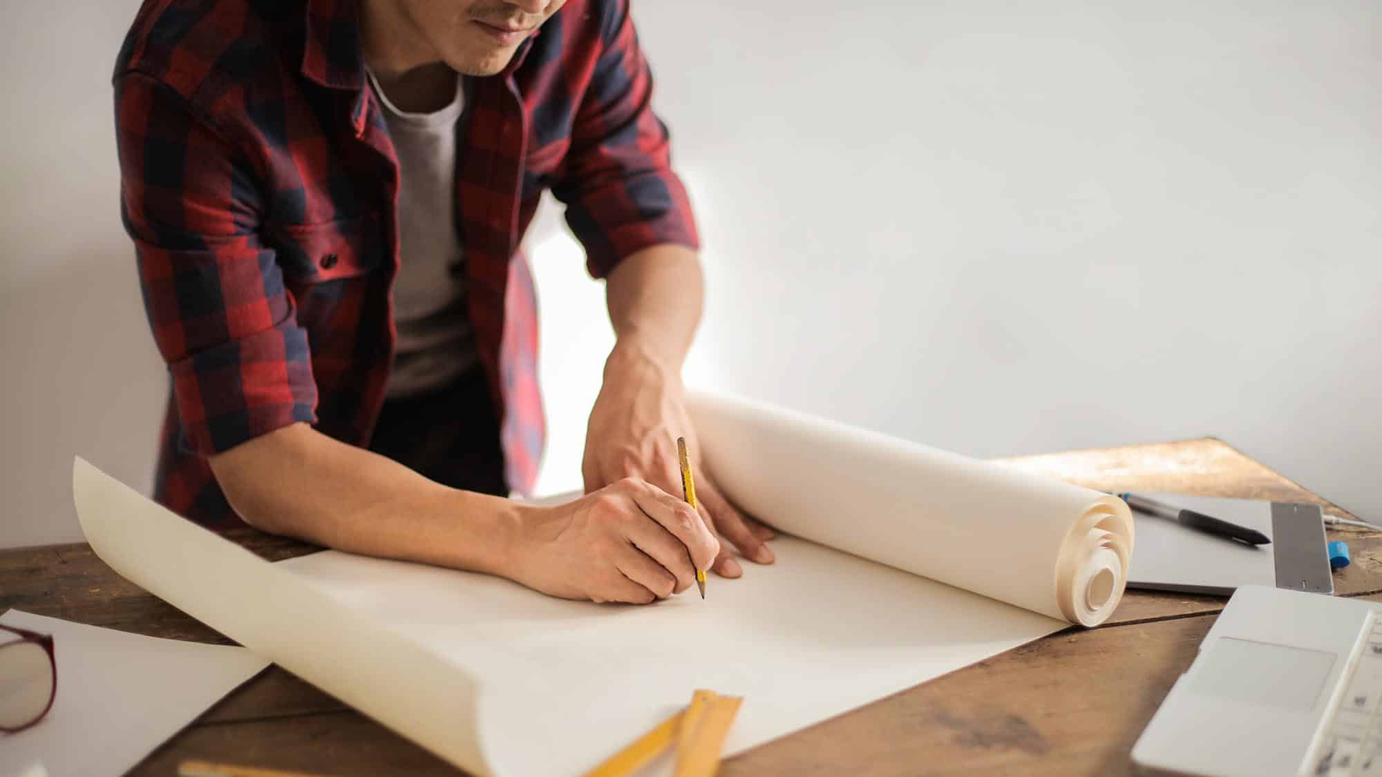 architect writing on paper